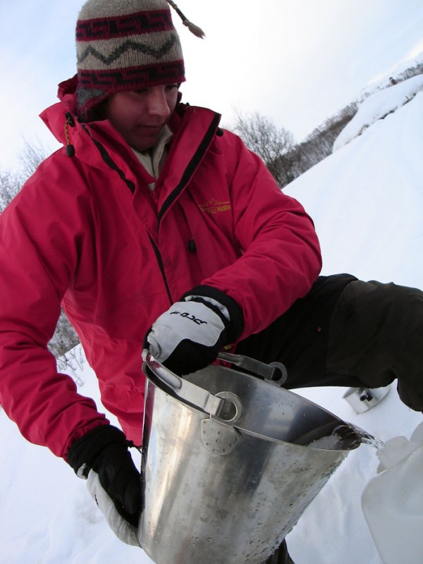 Einar Takes Water from the LakePhoto: Outdoor Lapland 
