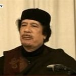 Merkel demands Qaddafi step down immediately
