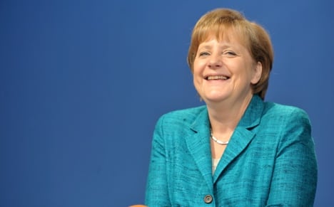 Merkel tells Germans to work harder too