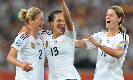 Germany tops group with win over France