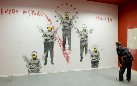 Eight-year-old Banksy work uncovered in Berlin