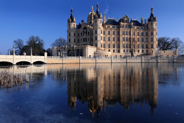 Schwerin Castle, Mecklenburg-Pomerania<br>Schwerin Castle is beautiful and practical – the elaborate building has housed Mecklenburg-Pomerania’s state parliament since 1990. Not only is Schwerin Castle a complex building, but its location – on an island between the Burgsee and Lake Schwerin – sets it apart among German castles. But guests should beware of the legendary Petermännchen, a tiny ghostly castle watchman rumoured to roam the halls, rewarding the good and punishing evil-doers.Photo: DPA
