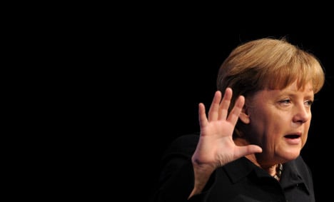 Merkel reins in EU weekend summit hopes