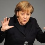 Merkel ups heat on Greece, rebuffs Brussels