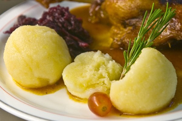 Knödel<br>Don’t be put off by its bland appearance; the German dumplings called Knödel or Klöße are a culinary must during the winter months. A doughy ball formed from flour, potato or breadcrumbs, this stodgy stroke of genius is a great addition to stews, on the side of a dish, or even as a meal itself. And for those who prefer sweet from savoury, the Knödel can also be made with sugar and fruit. Photo: DPA