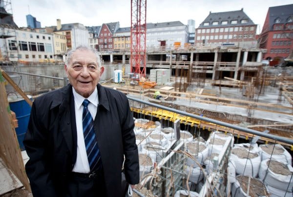 Frankfurt native Rolf Schmitz, 82, watches as the foundations are laid. 