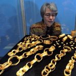 Archaeologists show off priceless gold haul