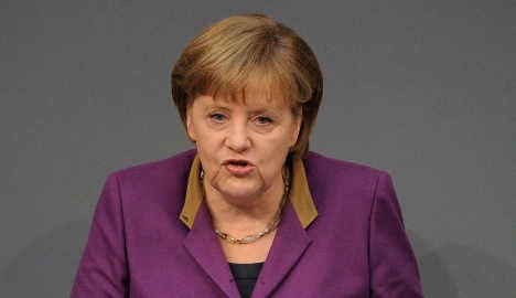 Merkel bows under pressure to up bailout