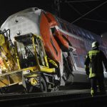 Train hits digger, kills three, injures 13