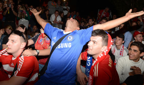 Munich mired in misery as Chelsea fans celebrate