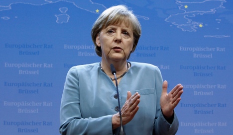 Merkel: Hard work, not eurobonds, will fix euro
