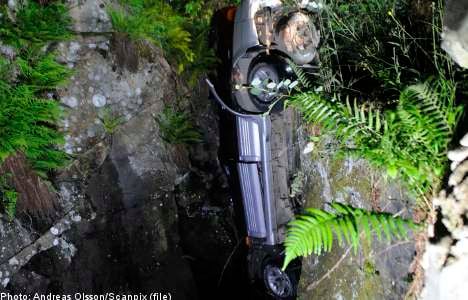Man survives after car plunges into ravine