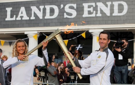 Olympic torch sponsor sends execs as runners