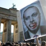 Protesters greet Turkish PM in Berlin
