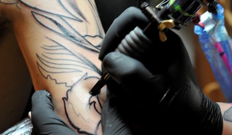 Court: Tattoos no reason to arrest cop career
