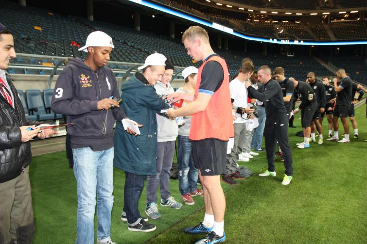 English players signing autographs at training session on Tuesday.Photo: British Embassy