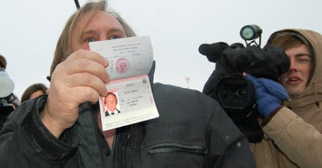 Depardieu shows off new Russian passport