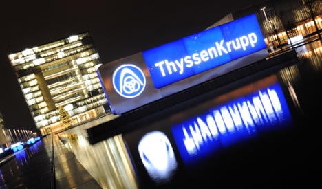 ThyssenKrupp halves pay after losses