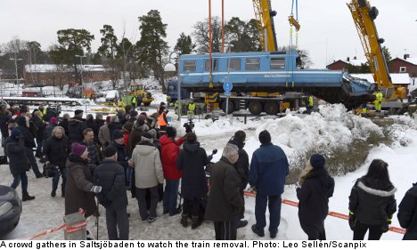 Crashed train removed from Stockholm house