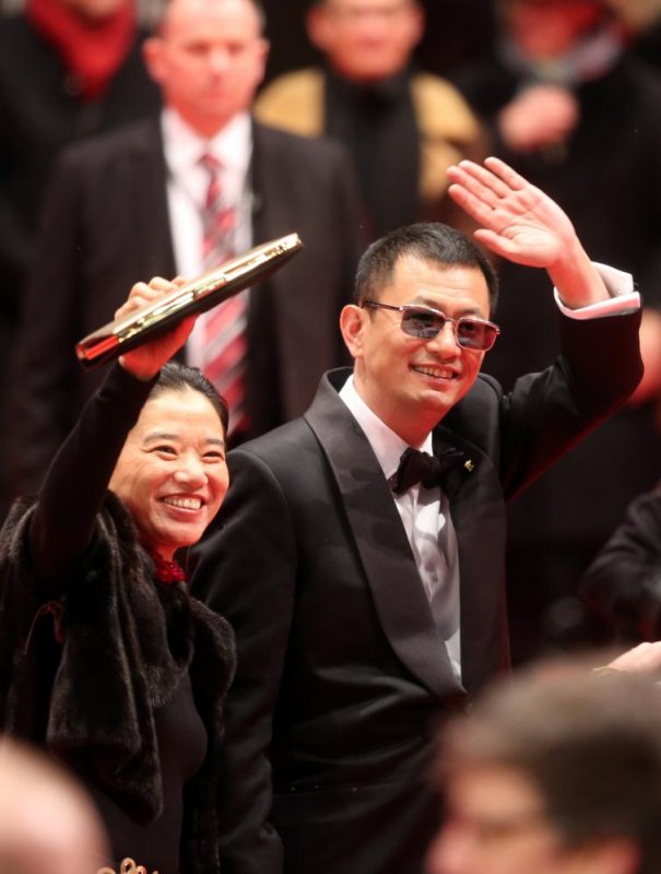 Chinese director and Berlinale jury president Wong Kar Wei (R) and his wife EstherPhoto: DPA