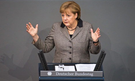 Merkel urges European Parliament to ok budget
