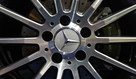 Daimler revs up profits on record sales