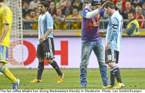 'Hugging hooligan' gives Messi shock embrace