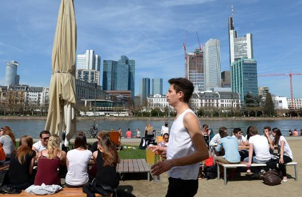 Young visitors to a riverside cafe in Frankfurt am Main.Photo: DPA