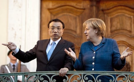 Merkel pledges to avert EU-China trade war