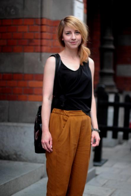 28-year-old Anna bucked the trend for all-out black, pairing her top with loose-fit, mustard trousers. A little spice is always nice.Photo: Elodie Pradet