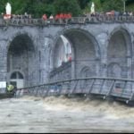 This screen shot taken from BFMTV shows how far the waters of the Gave de Pau river in Lourdes have risen. Photo: BFMTV
