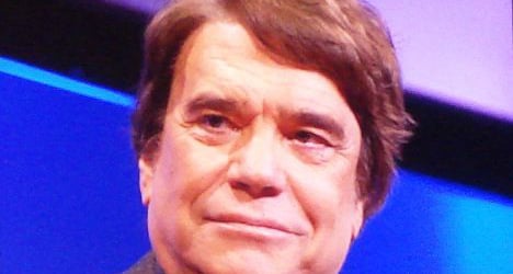 French tycoon Tapie held over corruption scandal