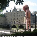 Naked peeing giant statue divides locals