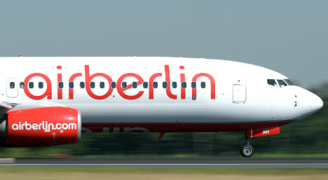 Air Berlin cuts losses by flying fewer routes