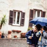 "These kids were in front of a church in Ostia Antica; they were walking around following the cats. It started to rain and one of their mothers came over and gave them an umbrella."Photo: Humans of Rome/Marco Massa