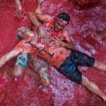 Revellers throw tomato pulp at each other during the annual "Tomatina" festival in Buñol.Photo: Biel Alino/AFP