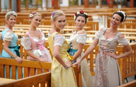 The latest dirndl designs are modelled in one of the Oktoberfest tents before guests arrive on Saturday. 