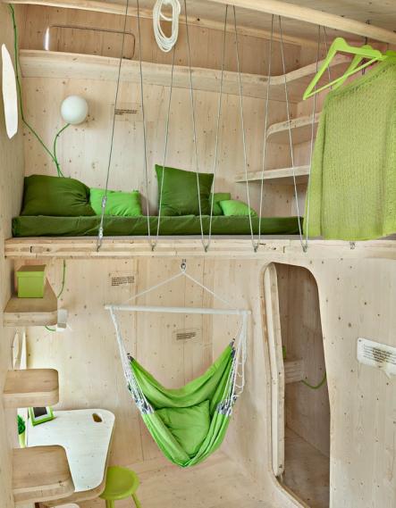 The micro-huts feature loft beds and plenty of shelf space.Photo: Bertil Hertzberg/Tengbom