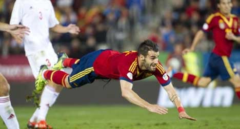 Bland Spain one point away from Brazil spot