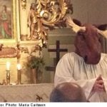 Pastor dons antlers for Swedish elk hunt sermon