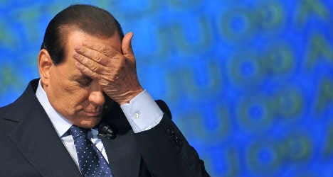 Berlusconi hit with two year political ban