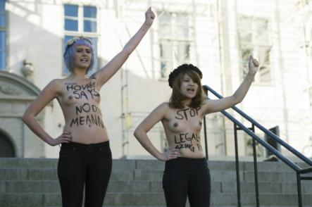 The pair chanted "One girl, six rapists. Still not asking for it. Stop legalizing rape" on the steps of the court.Photo: Leif R Jansson/Scanpix