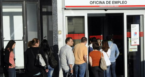Spain's jobless rate falls by smallest of margins