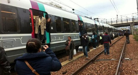 Furious Paris commuters take to the tracks
