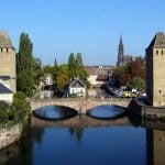 <strong>#4 Happiest – ALSACE.</strong> The smallest region in mainland France, and with Strasbourg on its German border, this eastern pocket of the country doesn’t top the table in any category. It did, however, perform very strongly in the three key economic areas – average income, poverty, and employment.Photo: The Ponts Couverts in Strasbourg, Alsace. Jonathan Martz