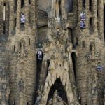 Members of the environmental group Greenpeace have suspended themselves with ropes from the top of Barcelona’s iconic Sagrada Familia Cathedral demanding the immediate release of thirty activists arrested on a Gazprom oil rig in the Russian Arctic.Photo: Josep Lago/AFP
