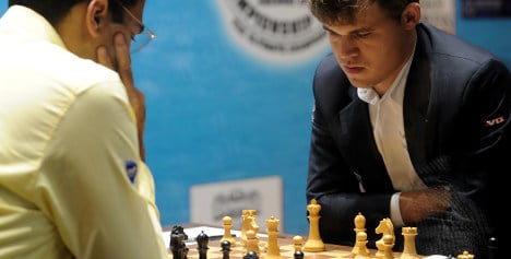 Norway's Carlsen claims world chess crown