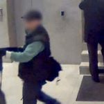 French police release images of the suspect, seen here threatening staff at BFM TV offices on Friday.Photo: CCTV BFM TV