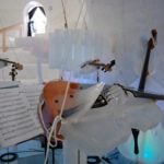 The breath of the violinists can melt their instrument, so a plastic shield is used to protect the violinPhoto: Ice Music