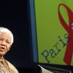 Former South African president Nelson Mandela is captured here as he gives a speech on the 14 July 2003 in Paris during the second day of an AIDS four-day conference. Noisy demonstrators demanding funds for HIV drugs in the developing world disrupted the conference but in doing so gained the beaming support of Nelson Mandela.Photo: Jean Ayissi